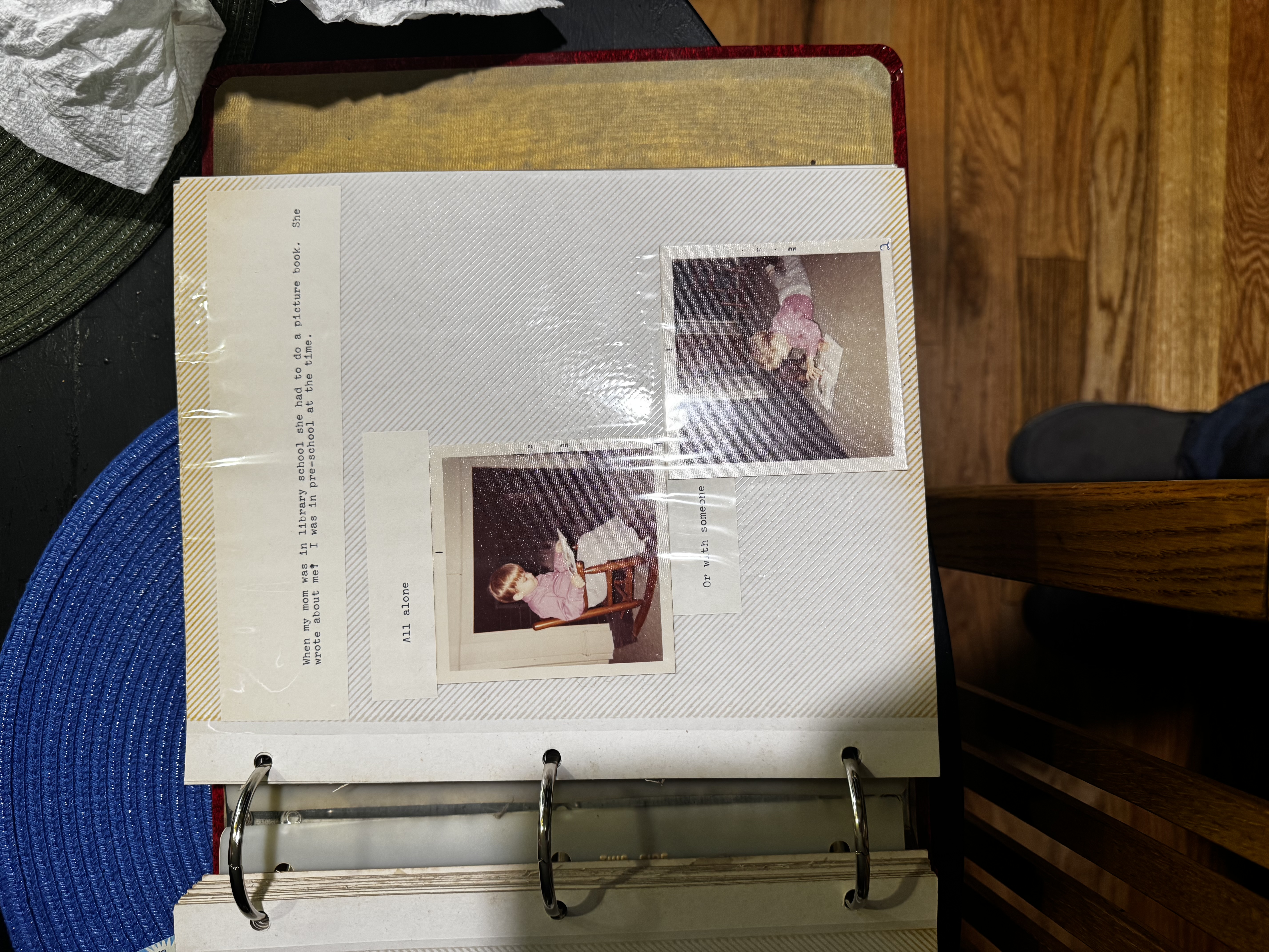 A scrapbook page from Chad's first 'book', showing him as a young child reading.