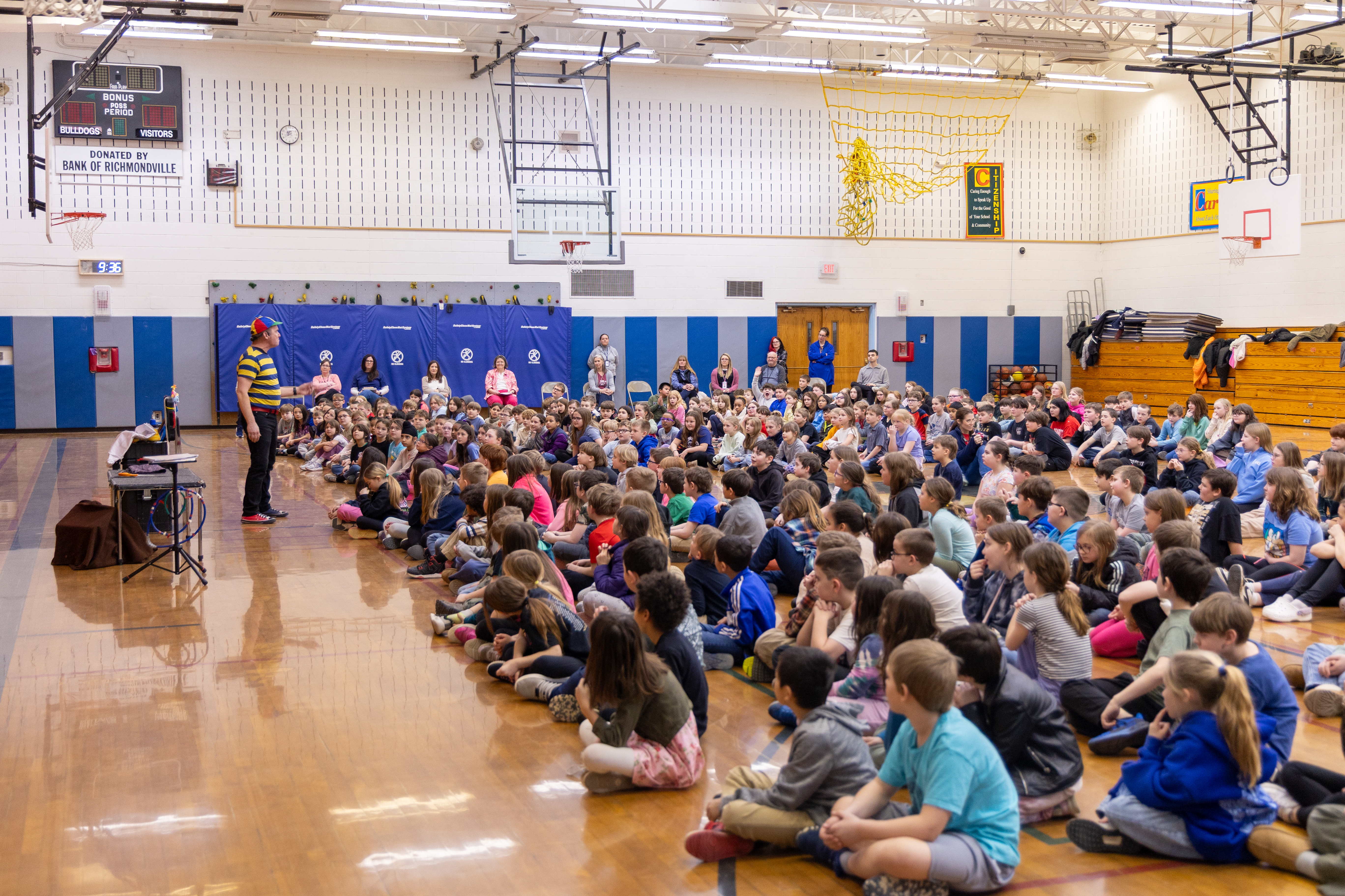 Mr. Twisty performing for a packed gymnasium