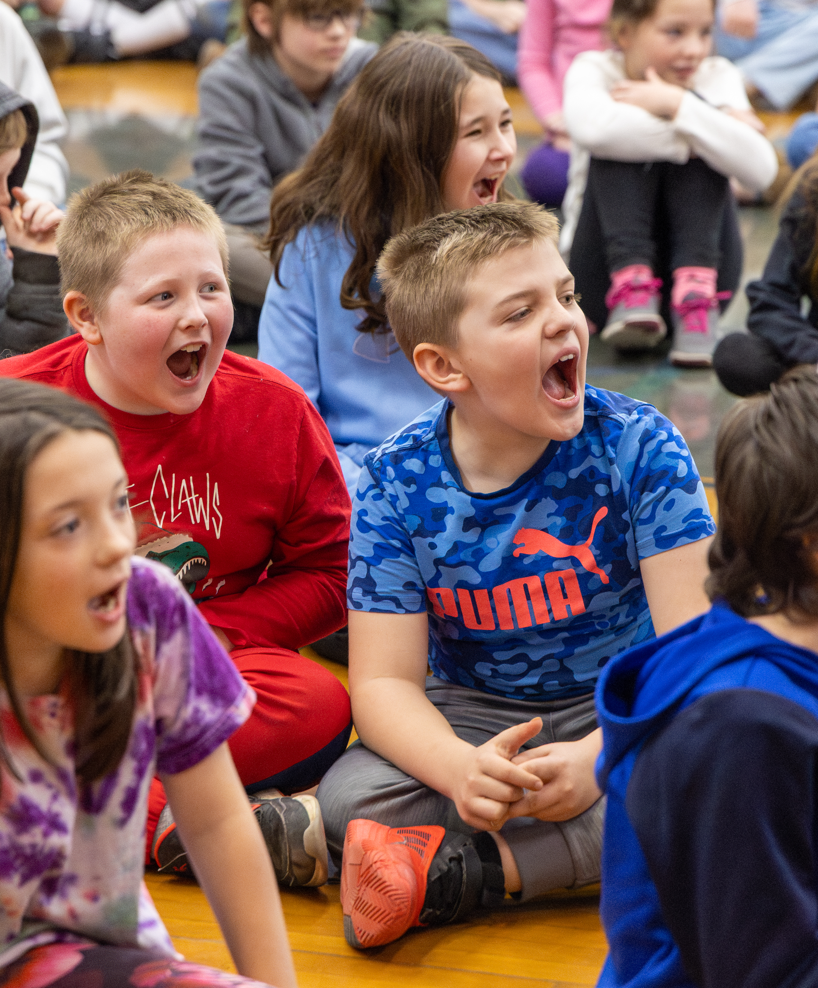 Two students laughing with delight