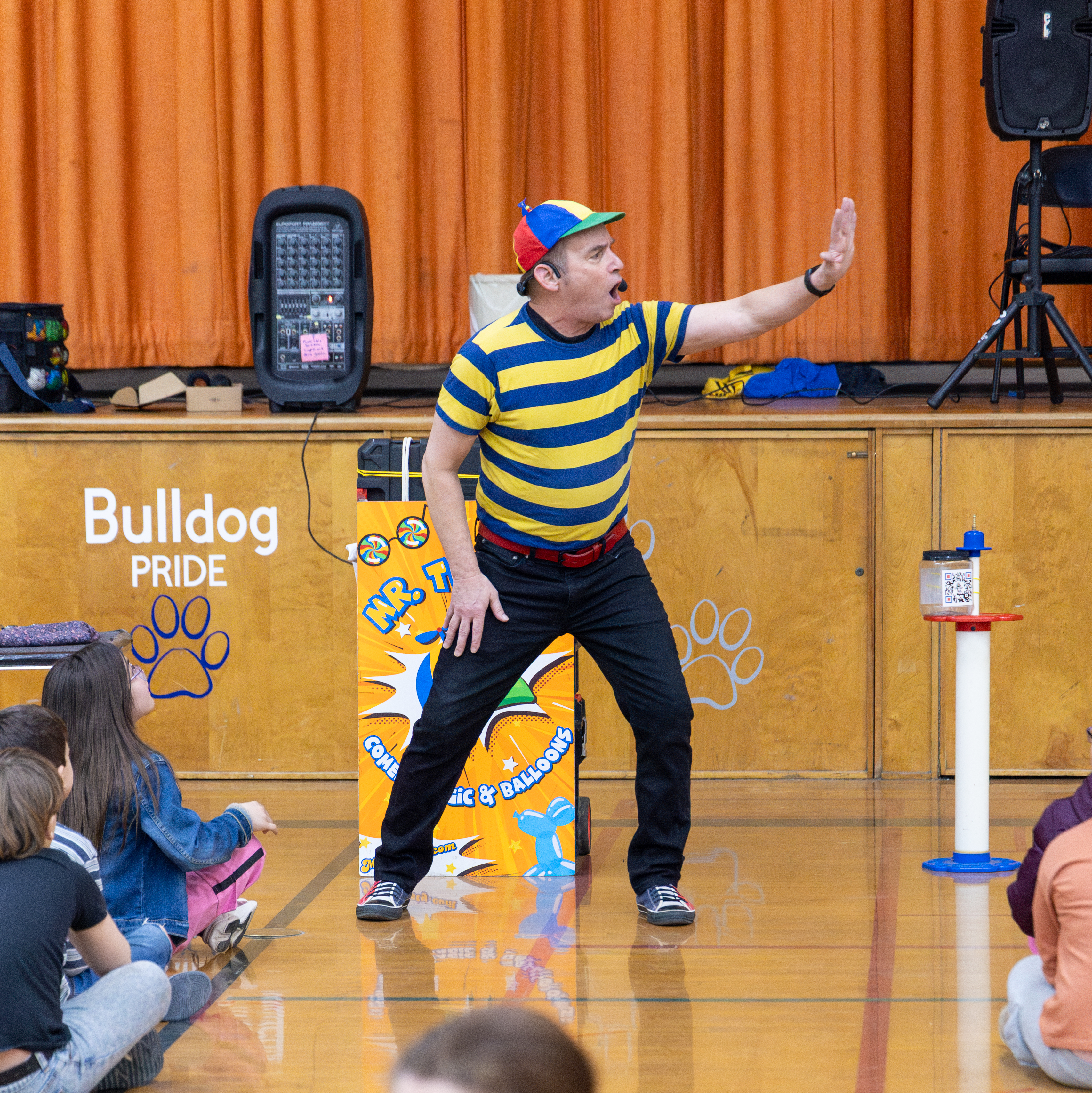 Mr. Twisty performing in his blue and yellow striped shirt