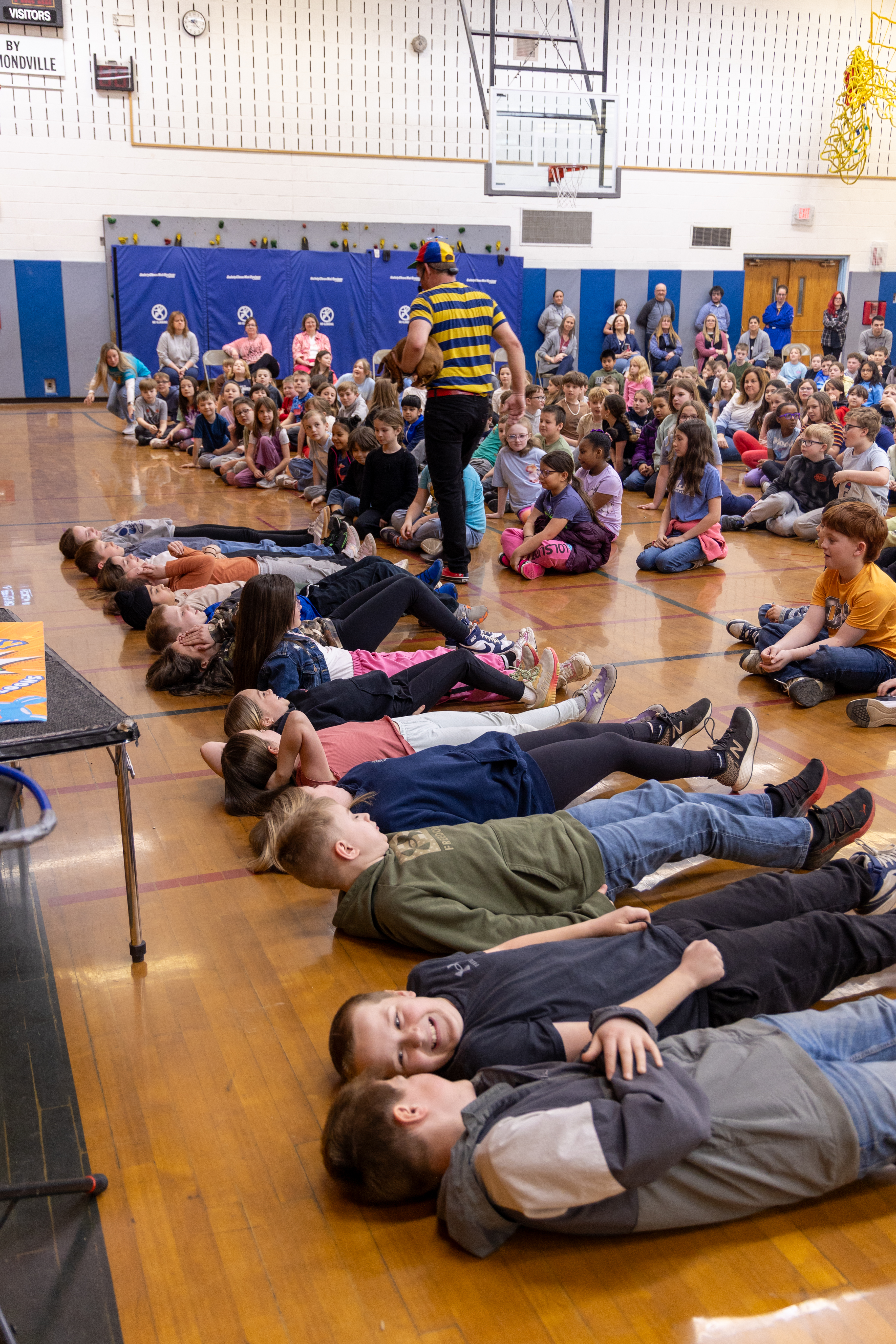 Students lying on the floor during the show