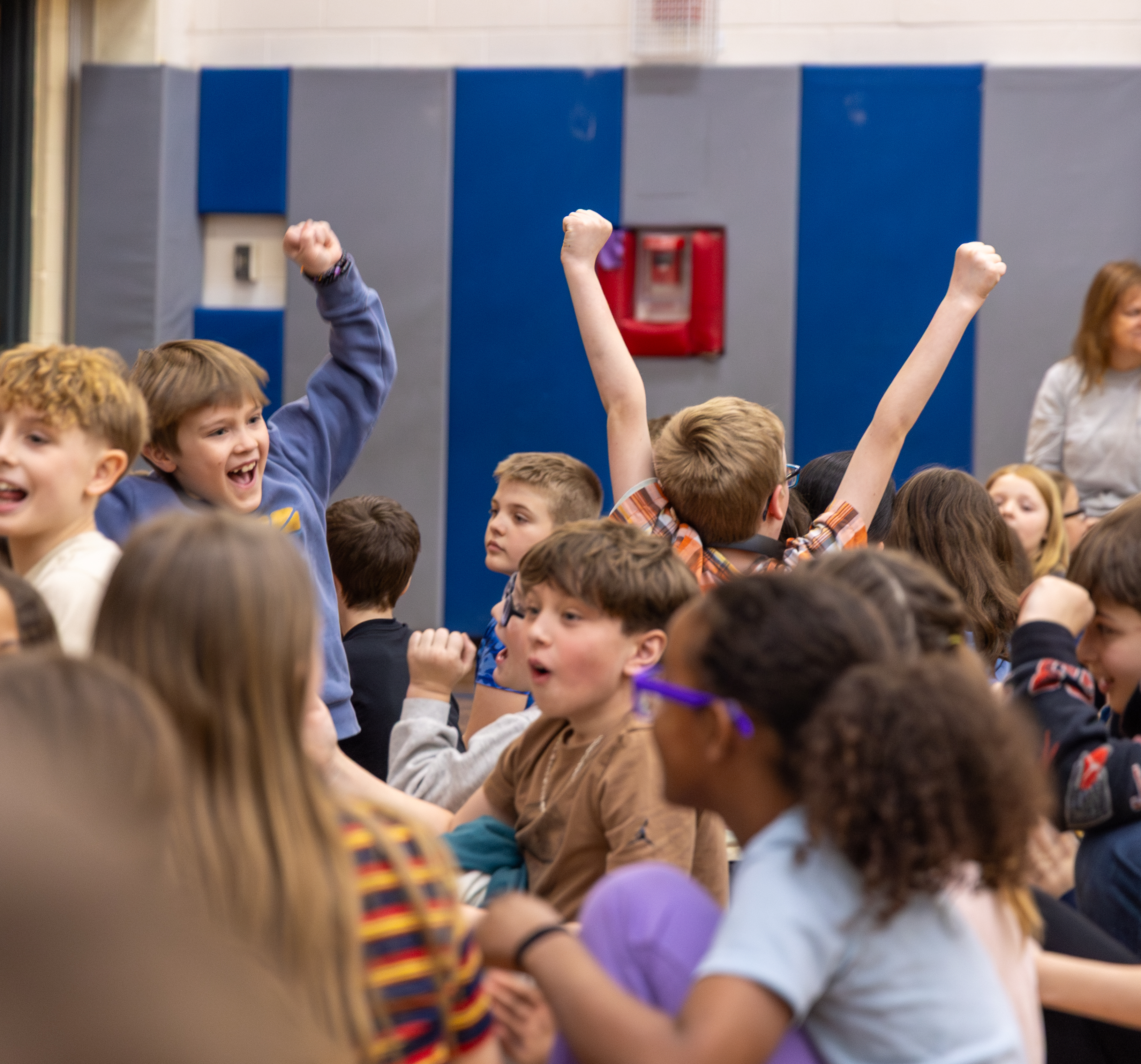 Students with fists raised in the air