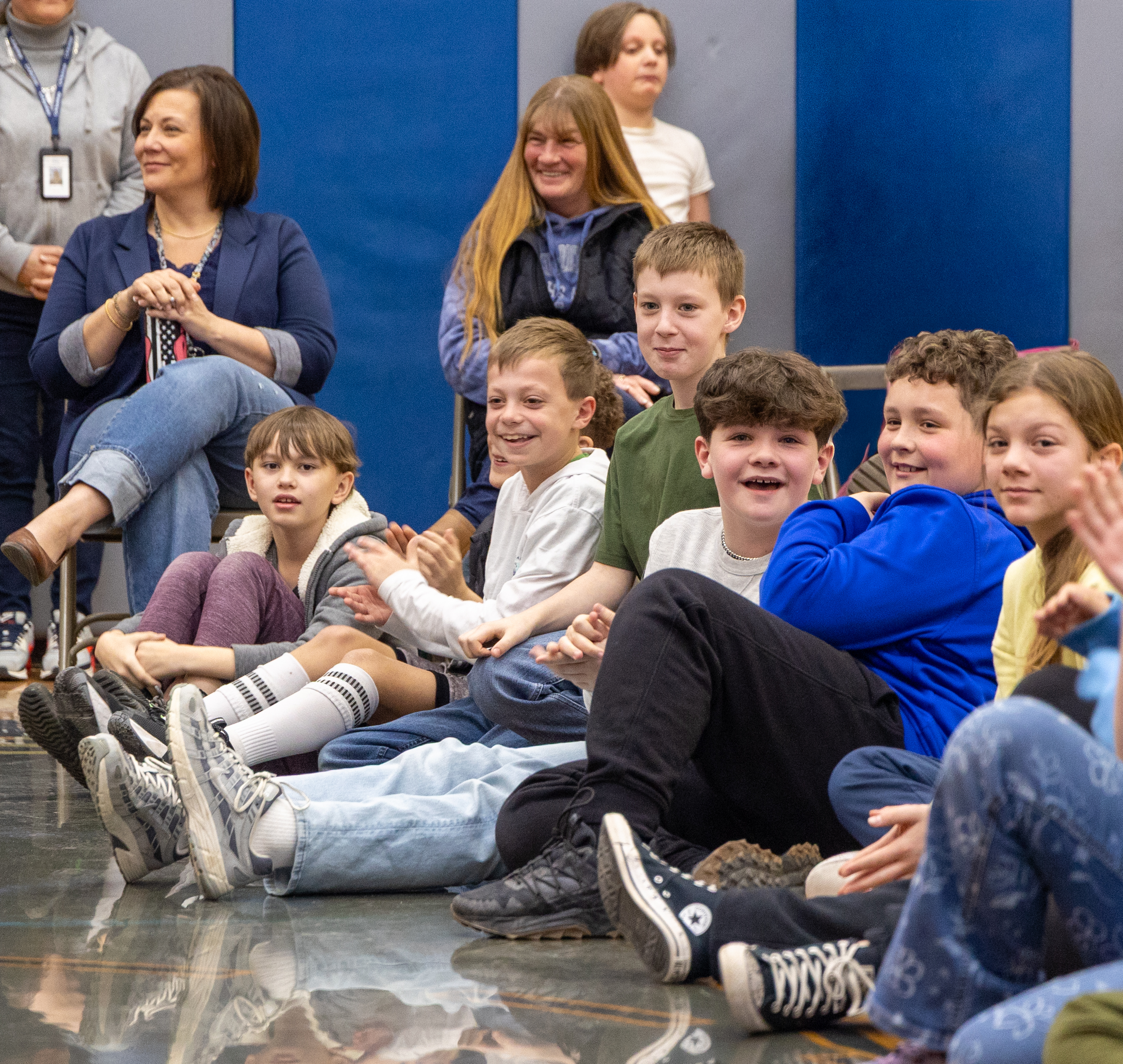A smiling student watching in fascination during the show
